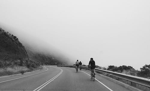 cyclists on a foggy road